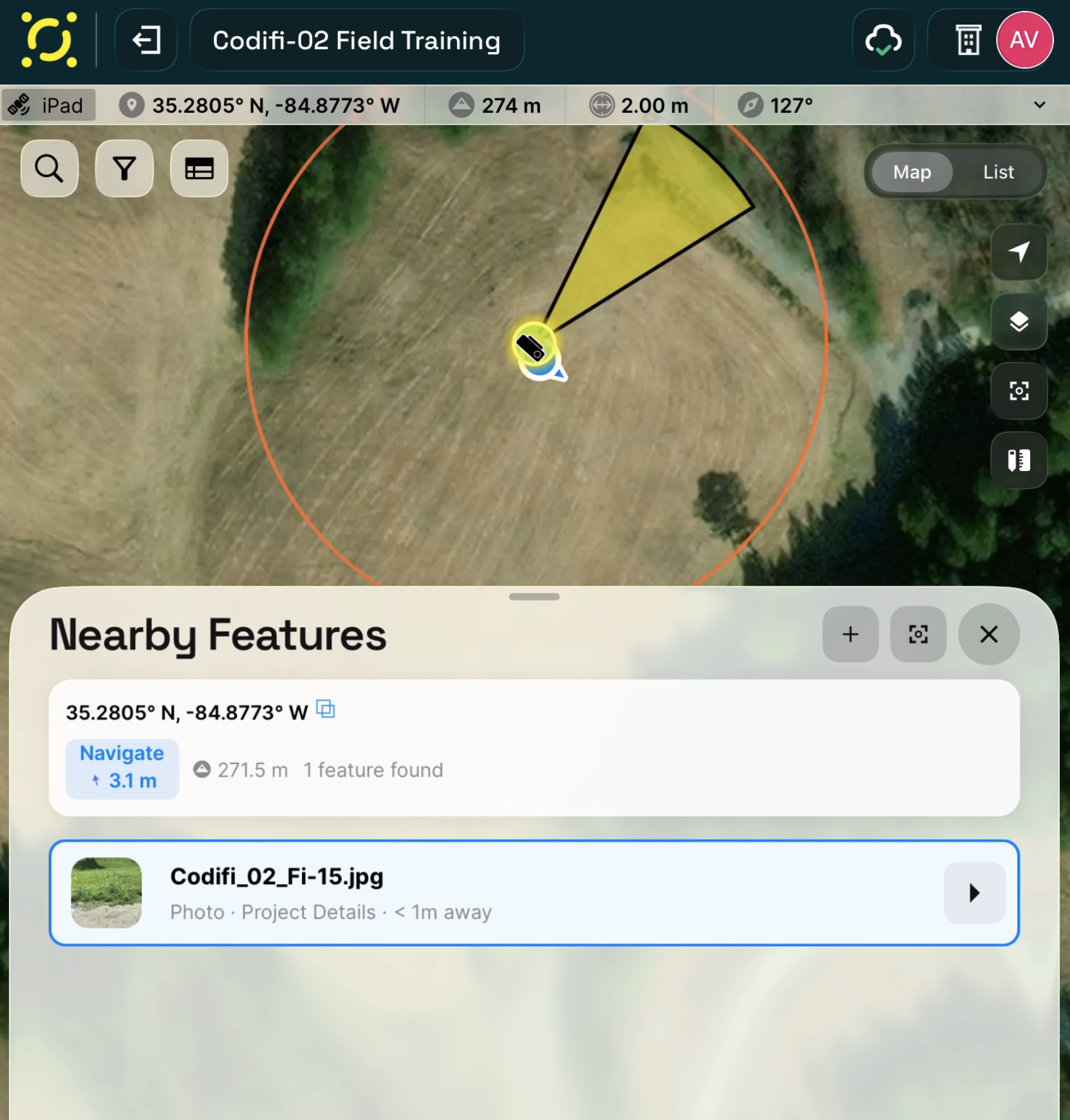 A photo selected in the Nearby Features list, with its camera marker and view cone highlighted on the map