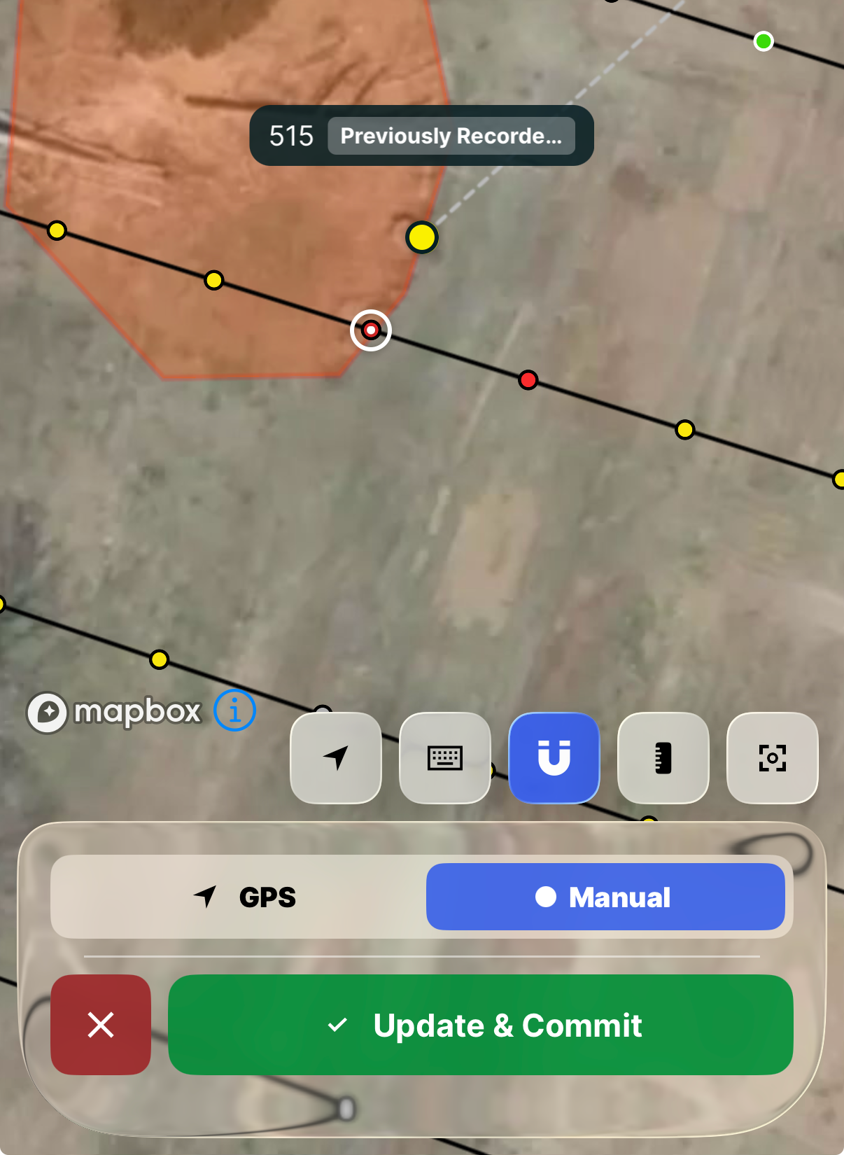 Draw Mode on mobile with the magnet button highlighted blue, the crosshair locked onto a line between two recorded points, and a label above naming the feature